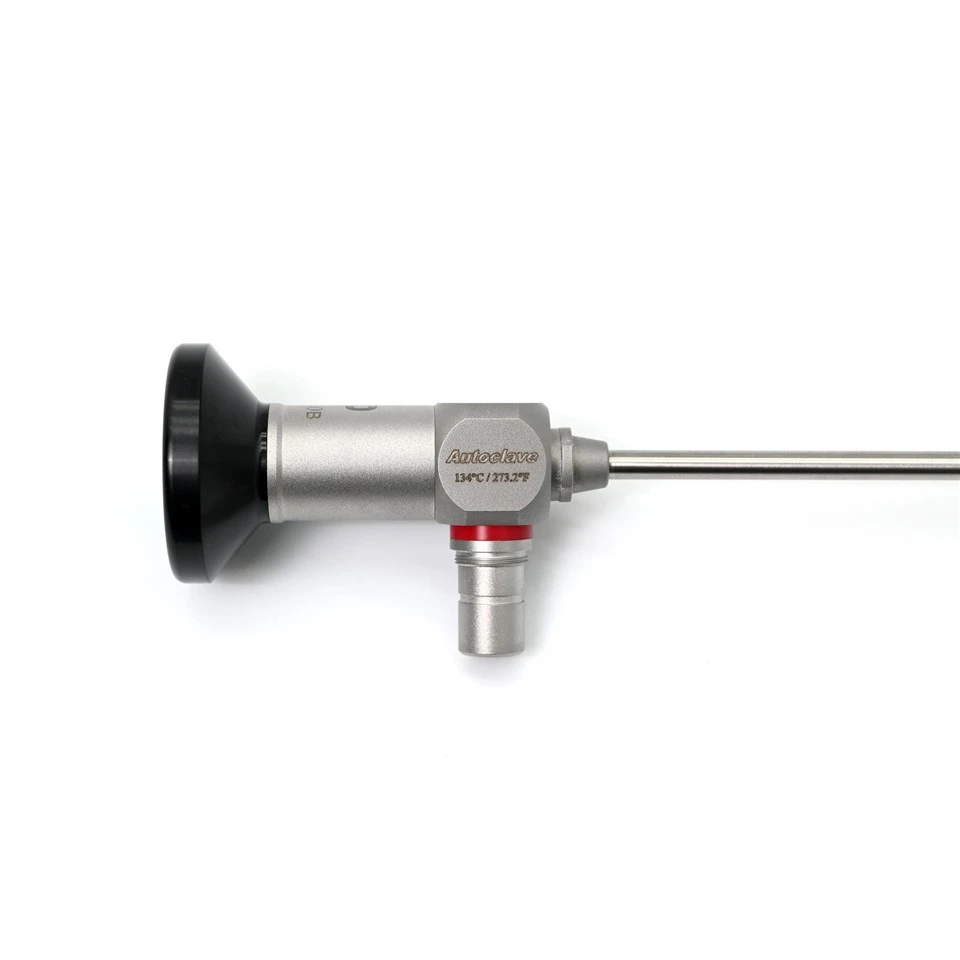Rigid cystoscope 30° light post and body close-up — autoclave 134°C / 273.2°F marking and red angle indicator ring